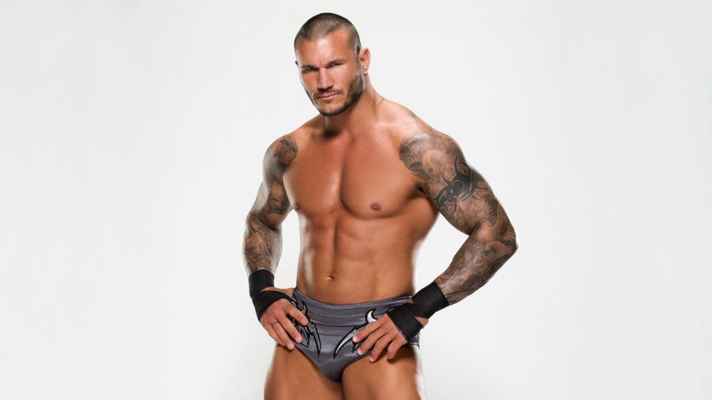 Randy Orton showcasing his tattoos