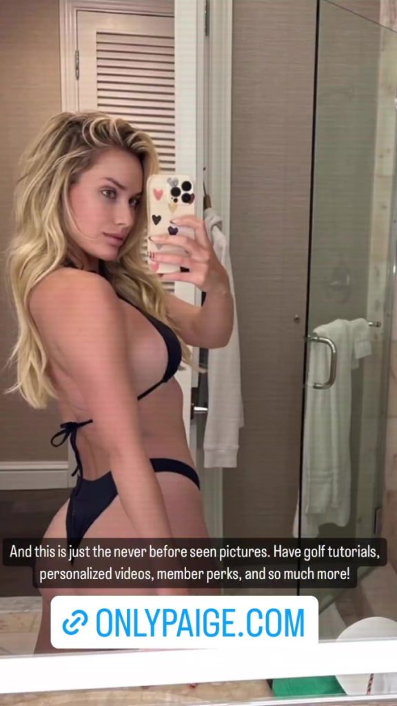 Paige Spiranac in black Bikini turned to the side to show off her curves